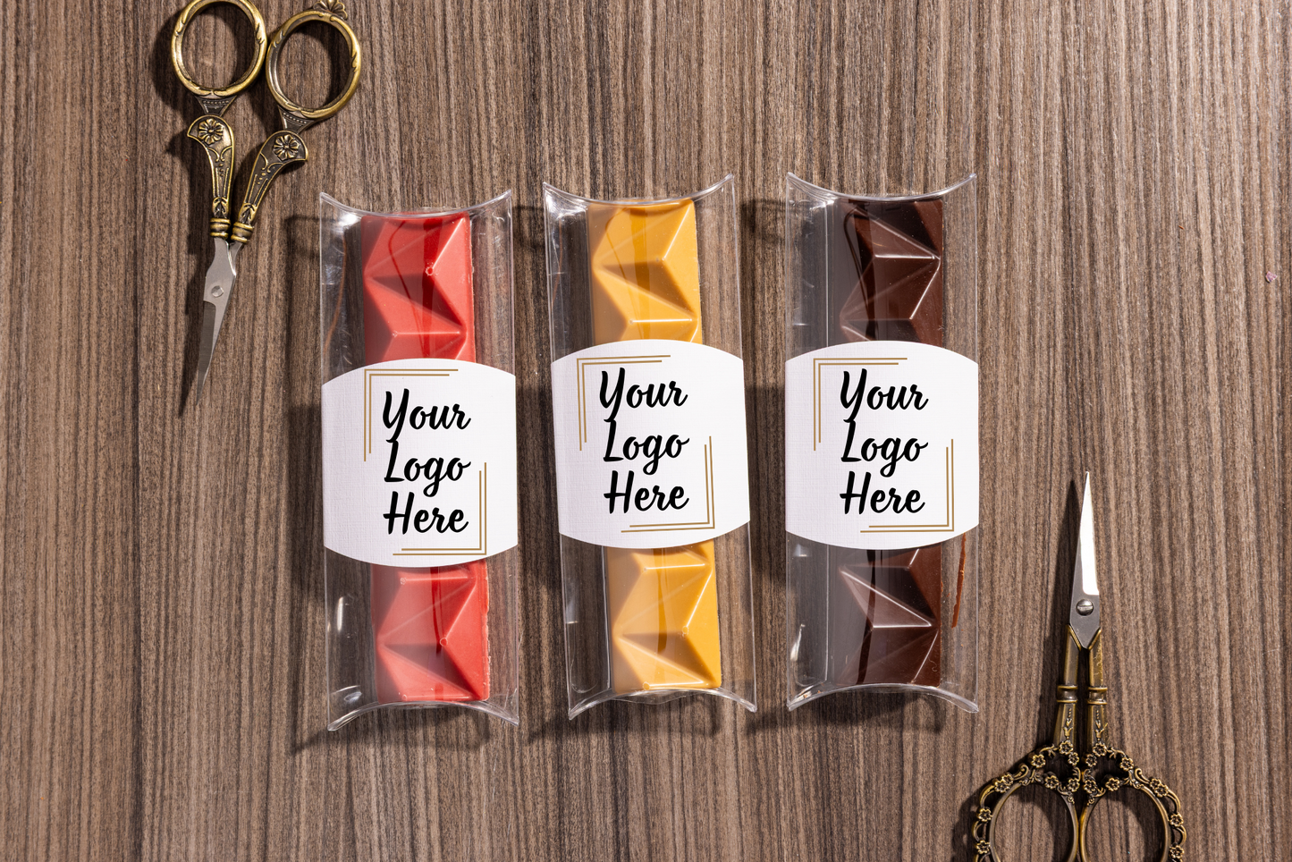 Three small packages with custom logo on gourmet chocolate bar