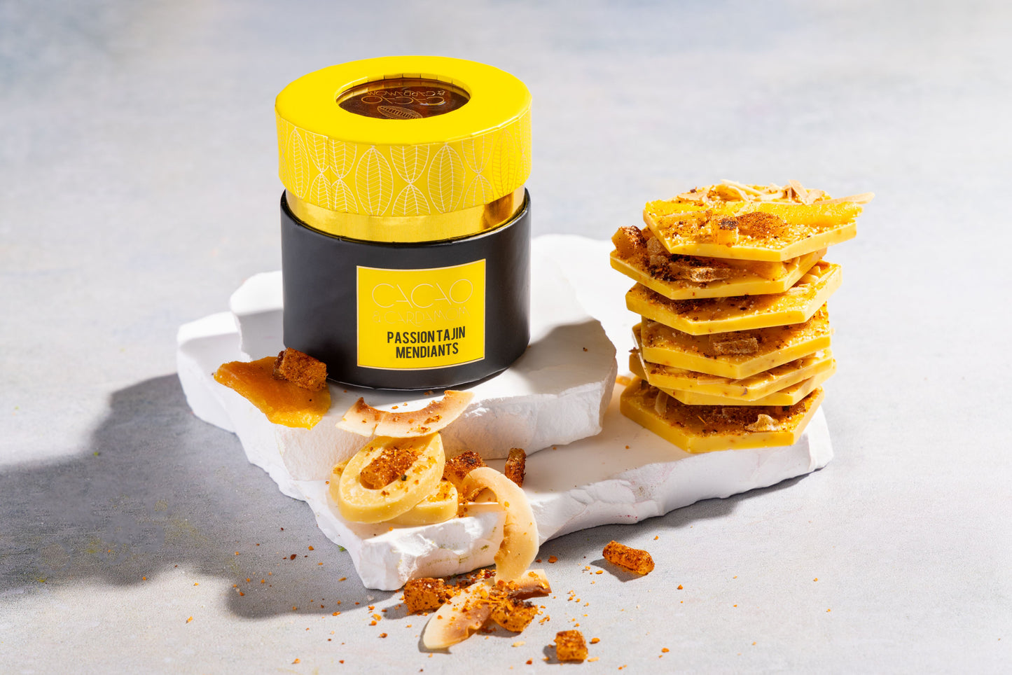 Close-up of Passionfruit Tajin artisan chocolate mendiants with premium toppings.