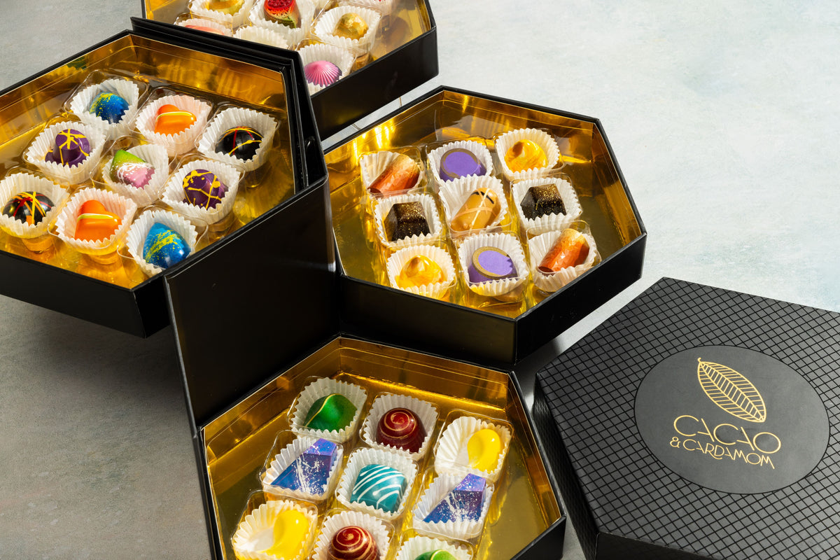 Assorted handcrafted gourmet chocolates from the Signature Chocolate Tasting Gift Set 36-piece by Cacao & Cardamom.