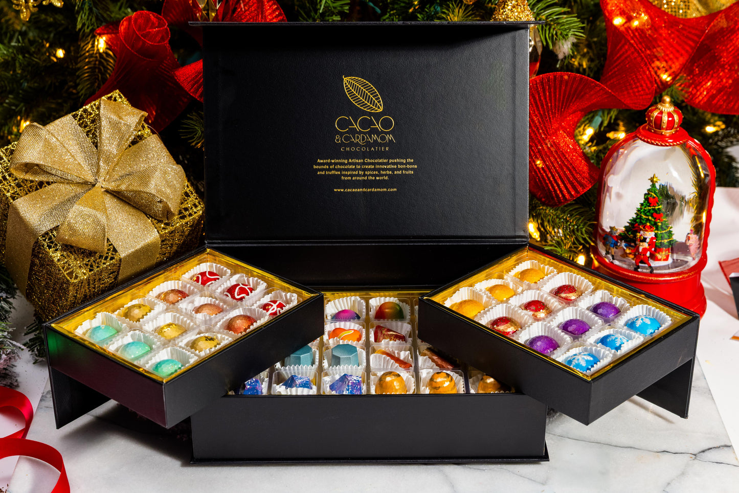 Open The Holiday Treasure Box 48-piece displaying handcrafted gourmet chocolates.