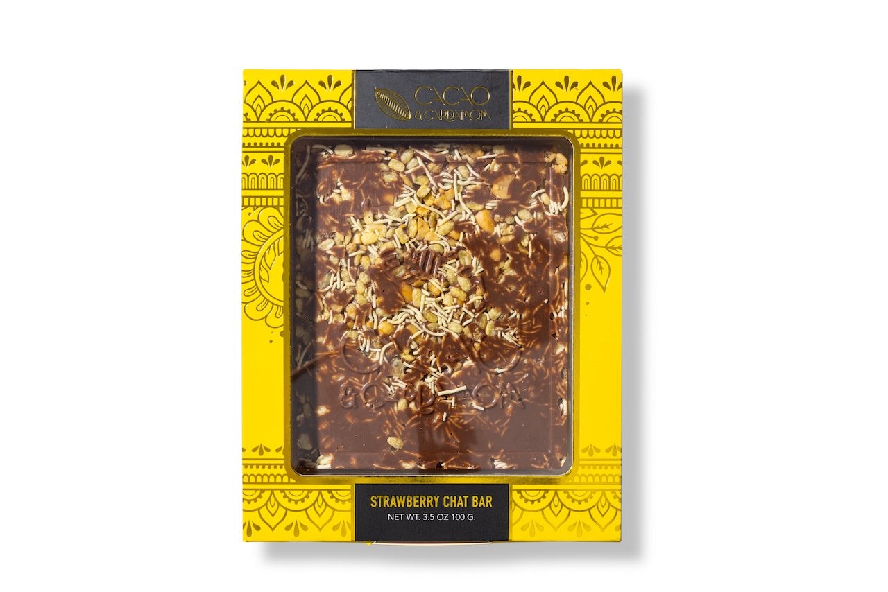 Close-up of the Chevdo Crunch artisan chocolate bar with crunchy toppings.