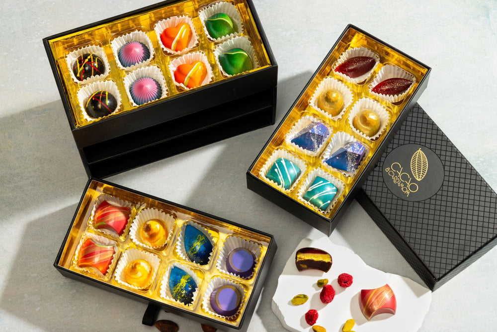 Three boxes of colorful chocolate bonbons