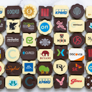 custom chocolate bonbons with various company logos and designs.