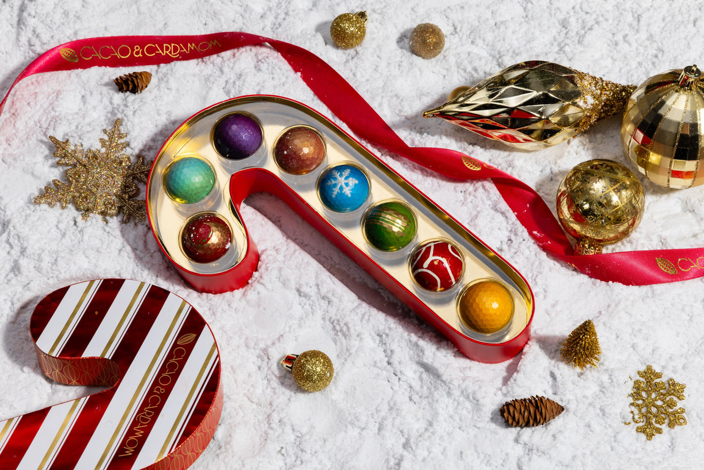 Interior of the Candy Cane Confections 8-piece revealing handcrafted artisan chocolates arranged inside the festive gift box.