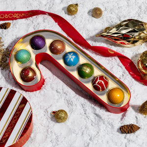 Interior of the Candy Cane Confections 8-piece revealing handcrafted artisan chocolates arranged inside the festive gift box.