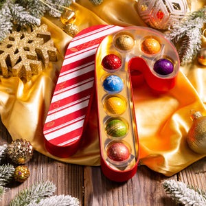 Open Candy Cane Confections 8-piece gift box displaying handcrafted gourmet chocolates.