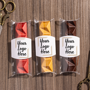 Three small packages with custom logo on gourmet chocolate bar 