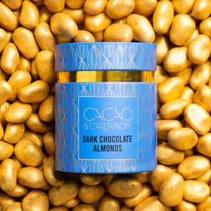 Close-up of Dark Chocolate Almond dragees coated in rich dark chocolate.