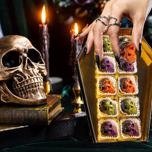 Interior of the Death by Chocolate Coffin Box 10-piece revealing handcrafted artisan chocolates arranged inside the Halloween-themed gift box.