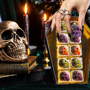 Top view of the Death by Chocolate Coffin Box 10-piece showcasing handcrafted artisan chocolates arranged in a premium Halloween-themed coffin gift box by Cacao & Cardamom.