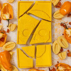 Unwrapped Mango Habanero artisan chocolate bar displaying handcrafted gourmet chocolate.