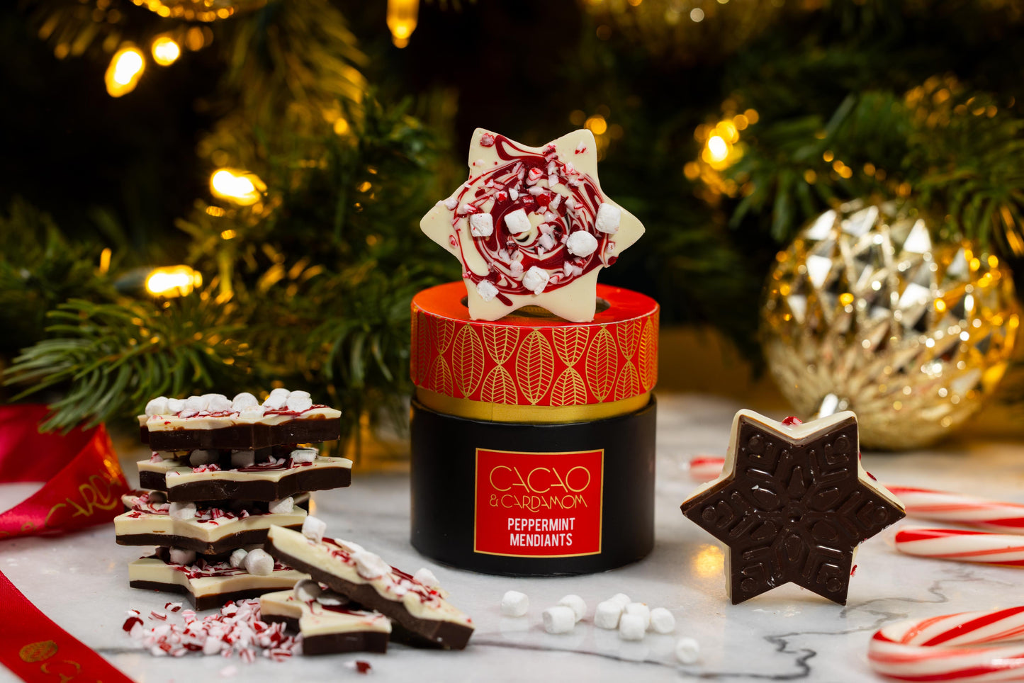 Peppermint Snowflake Mendiant featuring handcrafted artisan chocolate topped with festive peppermint and holiday decorations by Cacao & Cardamom.