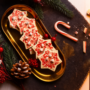 Peppermint Snowflake Mendiant displayed outside the gift box showcasing handcrafted artisan chocolate.