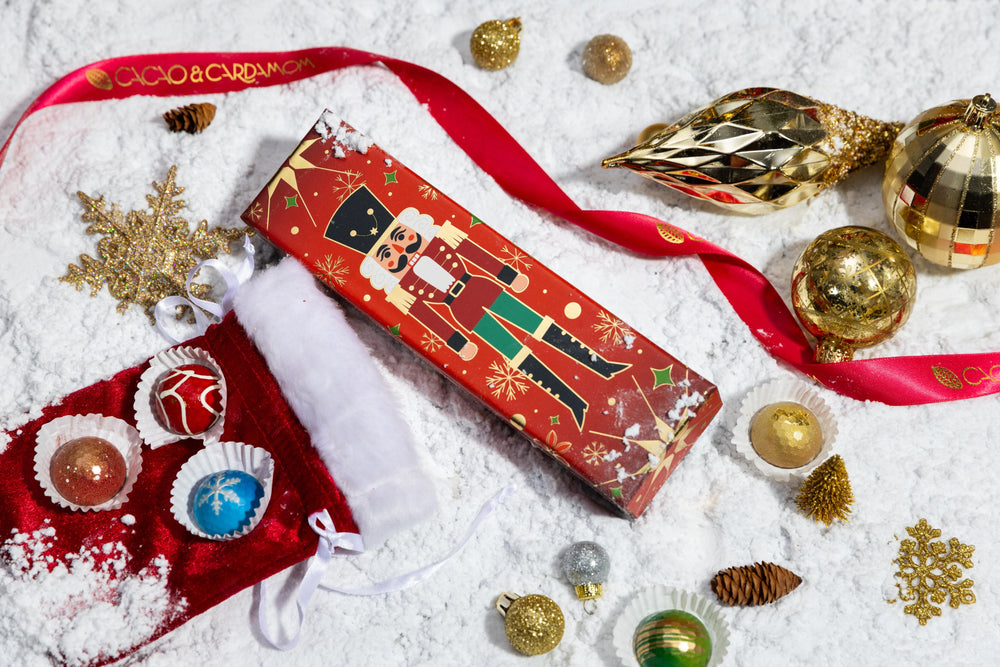 Top view of the Petite Nutcracker 5-piece showcasing handcrafted artisan chocolates arranged in a festive gift box.
