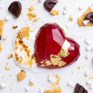 A heart-shaped, red chocolate bar with marshmallow and graham crackers