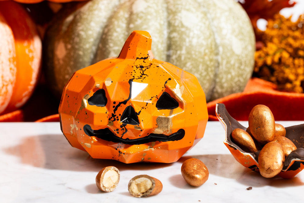 Smash Pumpkin handcrafted chocolate featuring a festive pumpkin design by Cacao & Cardamom.