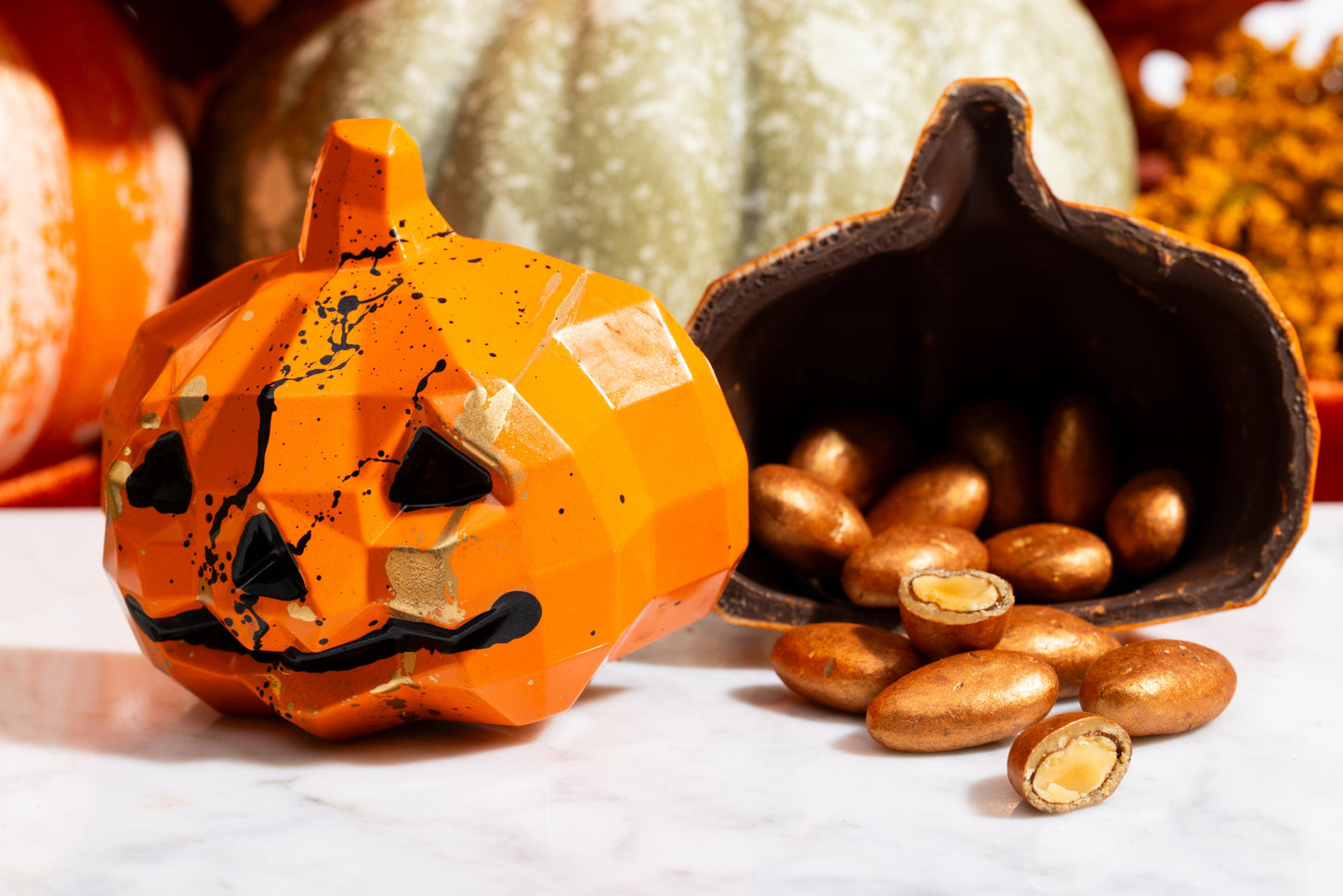 Close-up of the handcrafted Smash Pumpkin chocolate with festive pumpkin details.