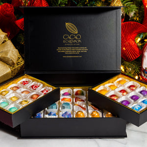 Open The Holiday Treasure Box 48-piece displaying handcrafted gourmet chocolates.