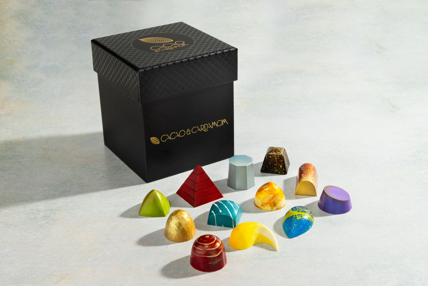 Three Tier Dozen Classic 12-piece featuring handcrafted artisan chocolates in a luxury gift box by Cacao & Cardamom.