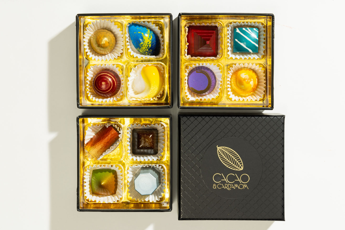 Top view of the Three Tier Dozen Classic 12-piece showcasing handcrafted artisan chocolates arranged in a luxury gift box by Cacao & Cardamom.