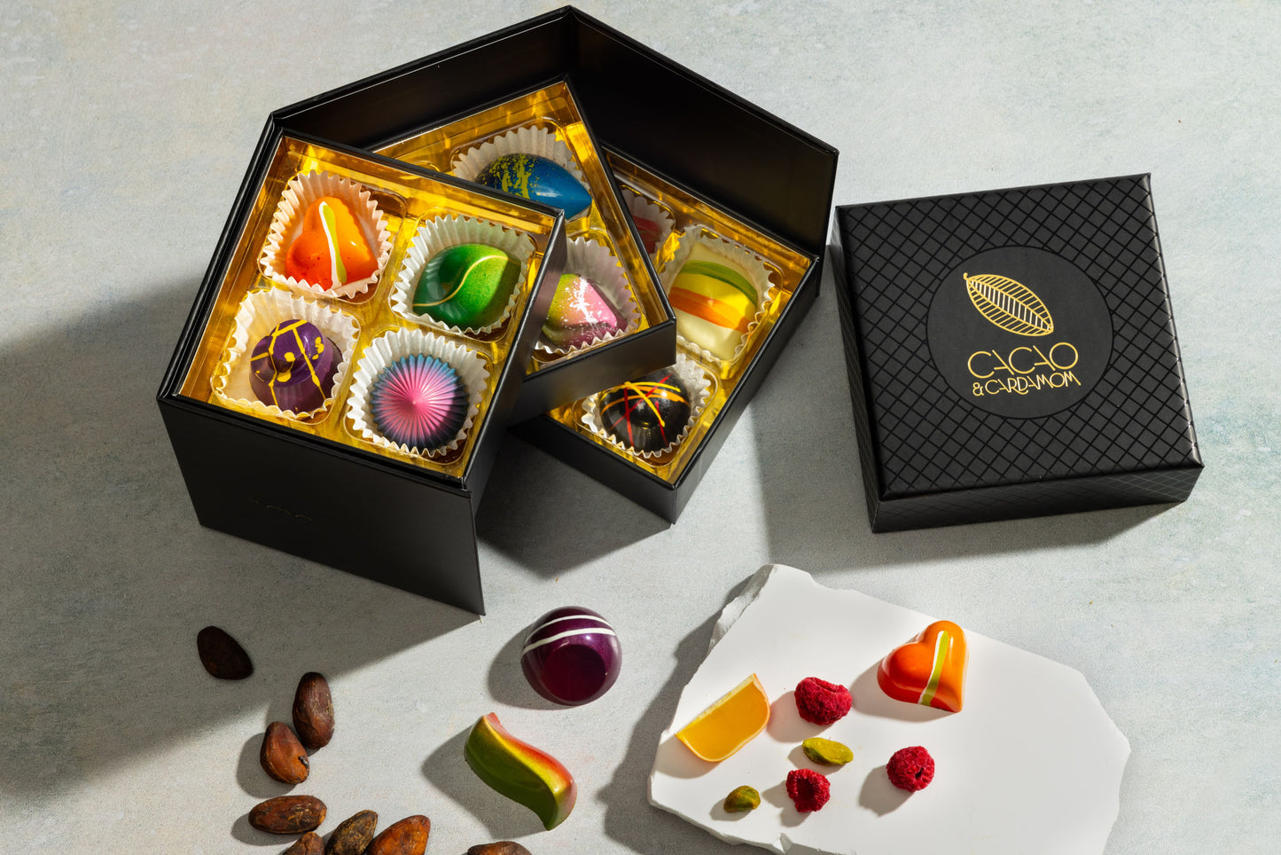 Close-up of handcrafted chocolates from the Three Tier Dozen Signature Collection 12-piece gift box.