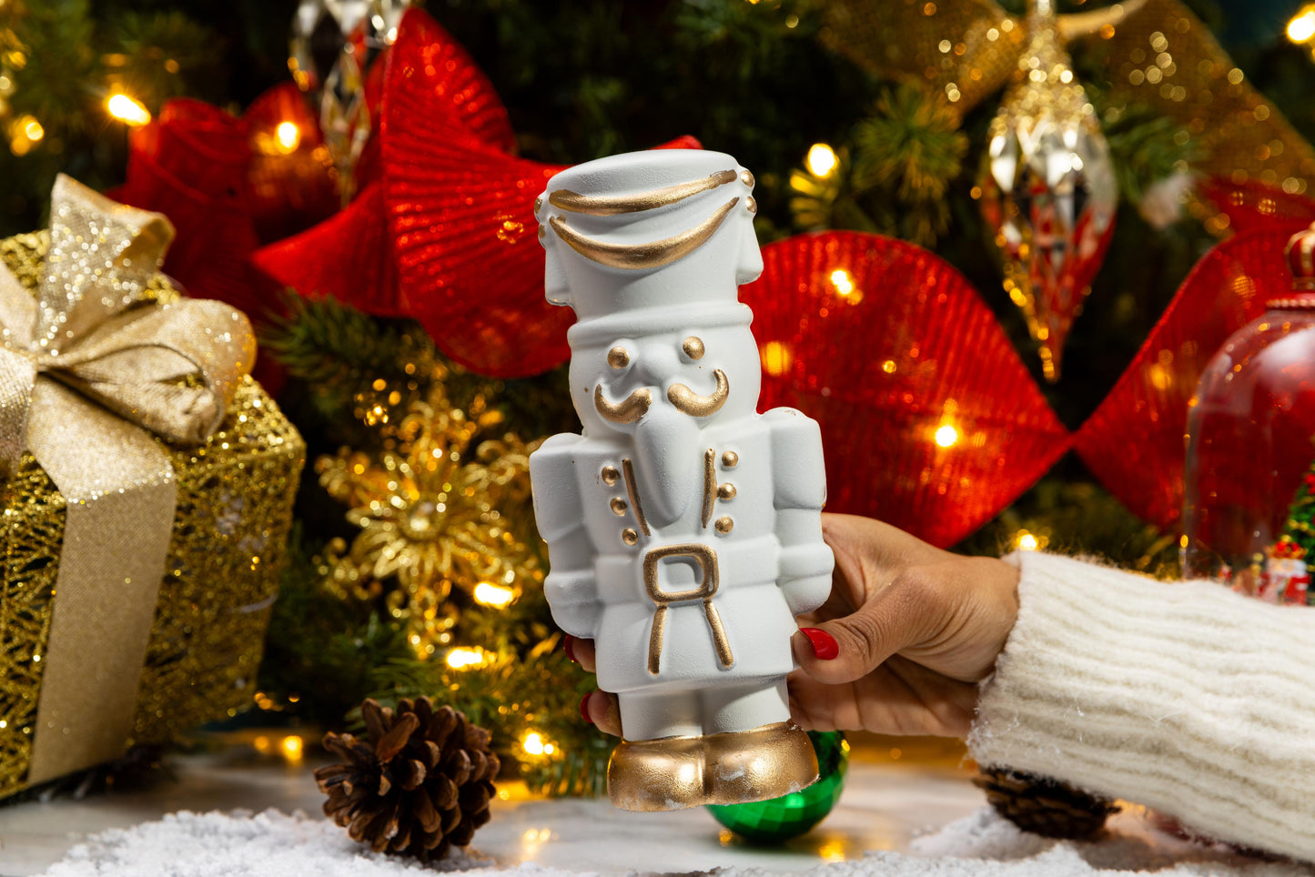 Close-up of the handcrafted White Chocolate Gourmet Nutcracker highlighting festive chocolate details.