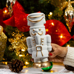 Close-up of the handcrafted White Chocolate Gourmet Nutcracker highlighting festive chocolate details.