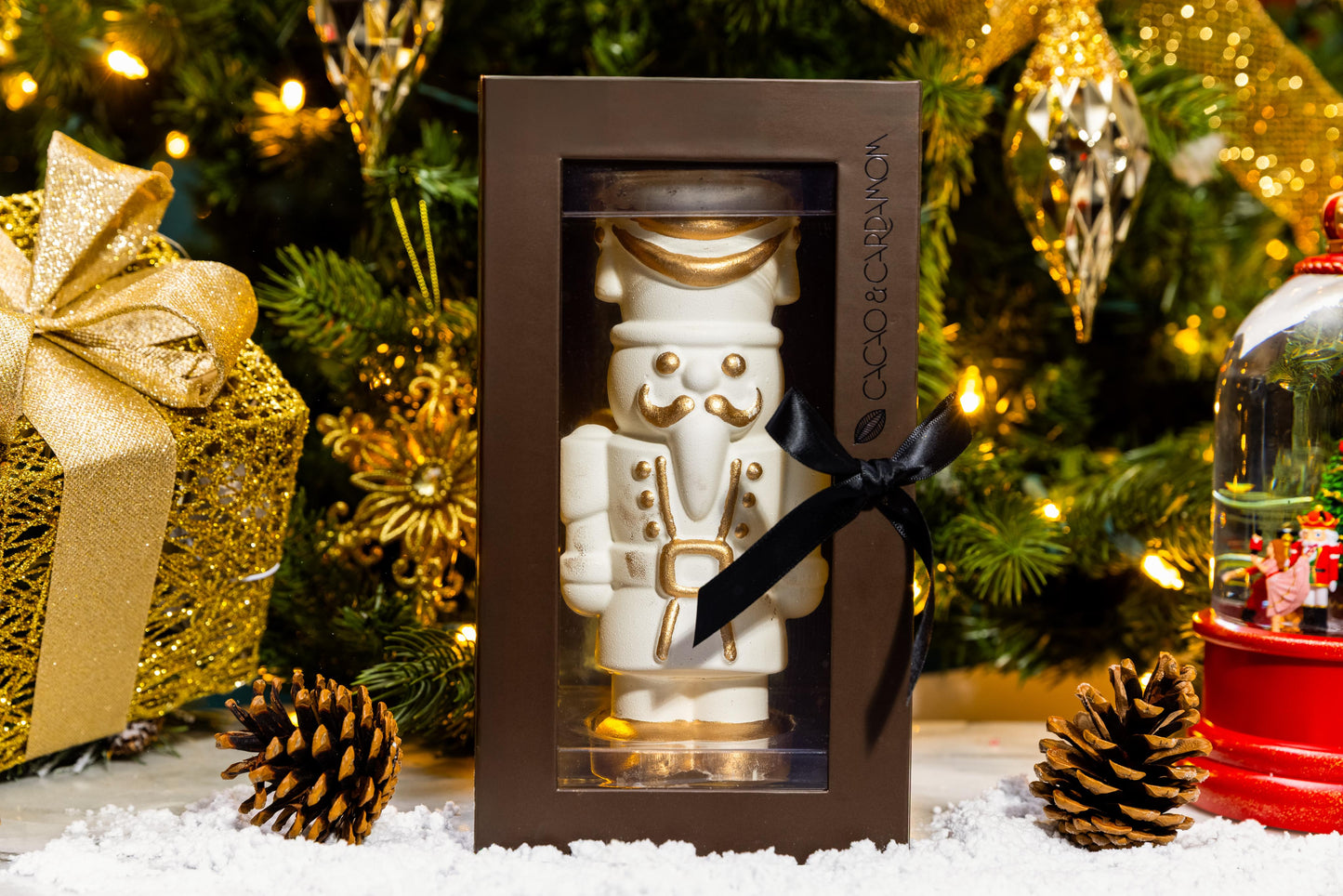 Front view of the White Chocolate Gourmet Nutcracker showcasing handcrafted white chocolate details.