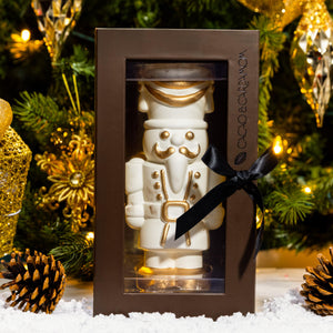 Front view of the White Chocolate Gourmet Nutcracker showcasing handcrafted white chocolate details.