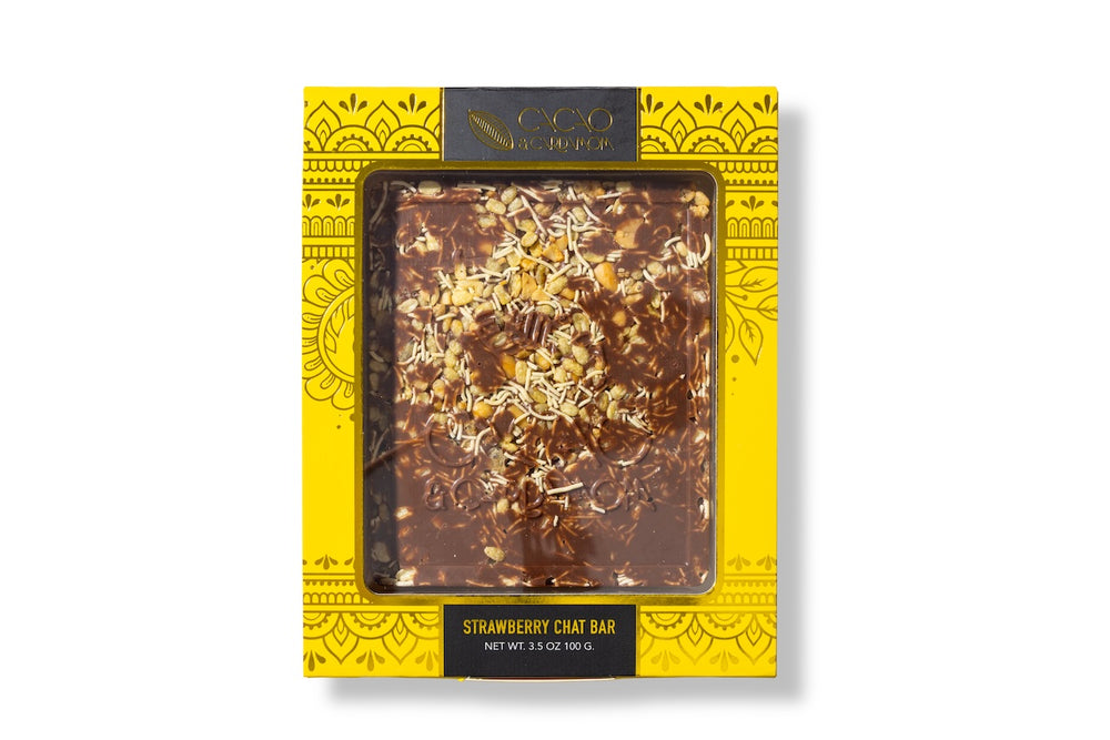 Close-up of the Chevdo Crunch artisan chocolate bar with crunchy toppings.