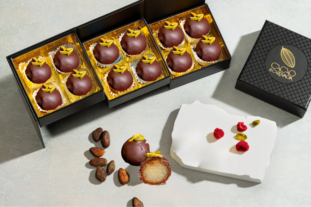 Open Chocolate Covered Gulab Jamun 12-piece gift box displaying handcrafted artisan chocolates.