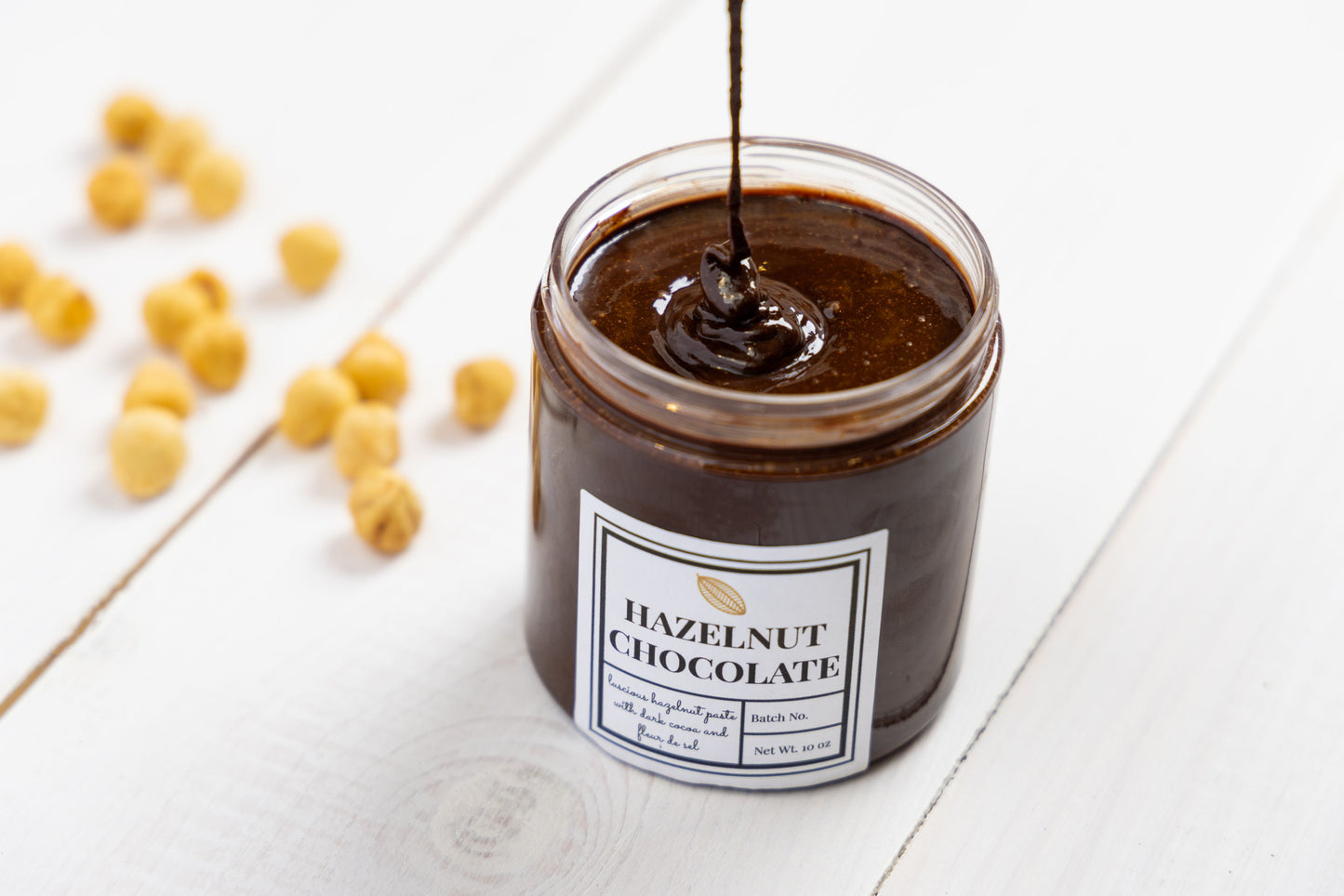 Open jar of Hazelnut Chocolate Spread showcasing its rich and creamy texture.