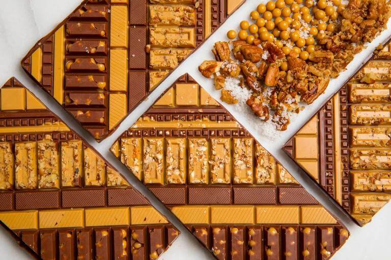 Texas Pecan Artisan Bar featuring handcrafted premium chocolate with roasted Texas pecans by Cacao & Cardamom.